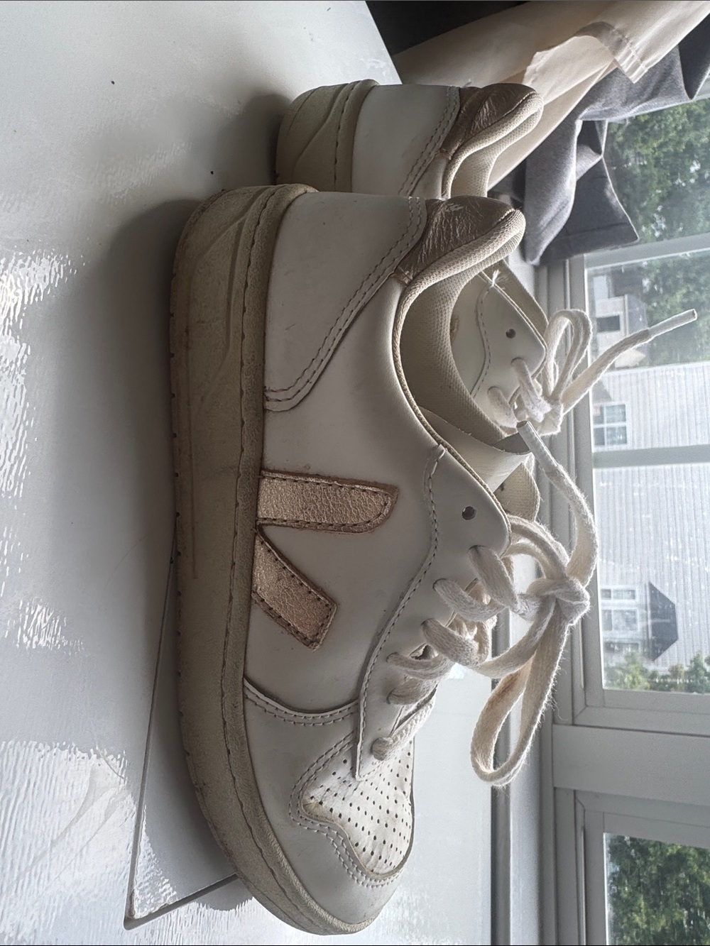 Veja white sneakers with metallic gold V logo